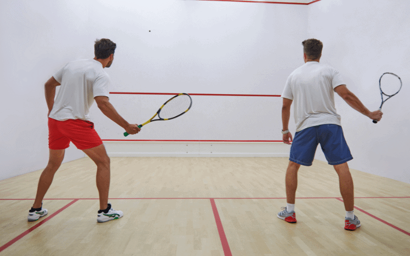 Players executing various squash techniques and strategies on the court