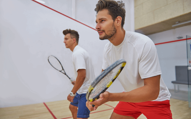 A squash player executes various techniques and strategies on the court